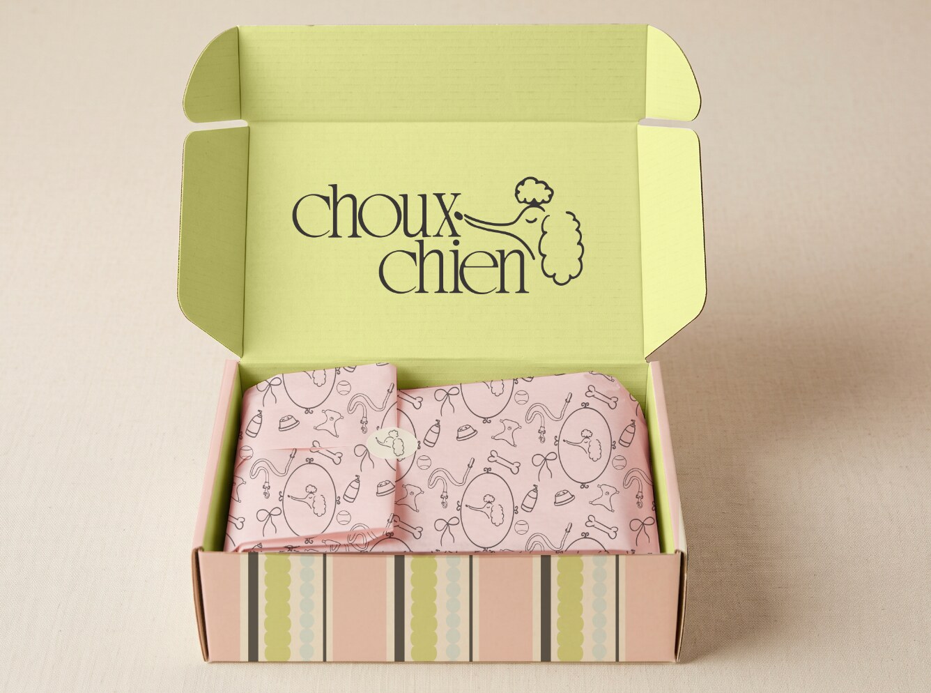 Open Choux Chien branded shipping box with patterned tissue paper