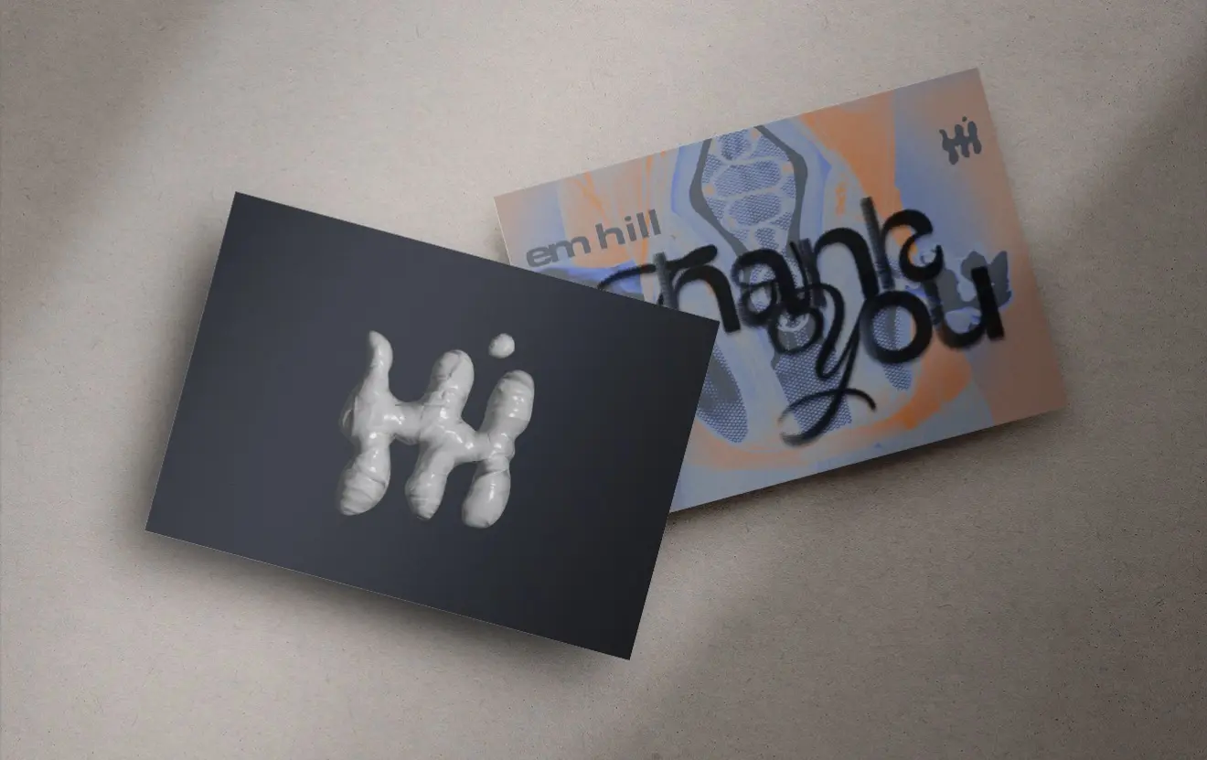 Em Hill business cards with dimensional mark and orange and blue campaign artwork