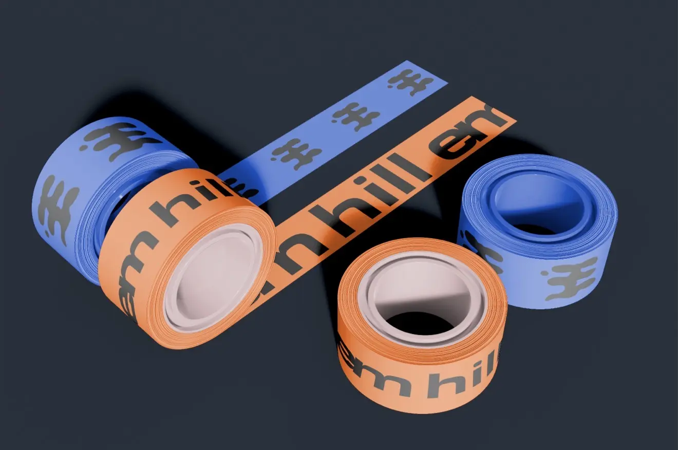 Blue and orange Em Hill branded packaging tape rolls