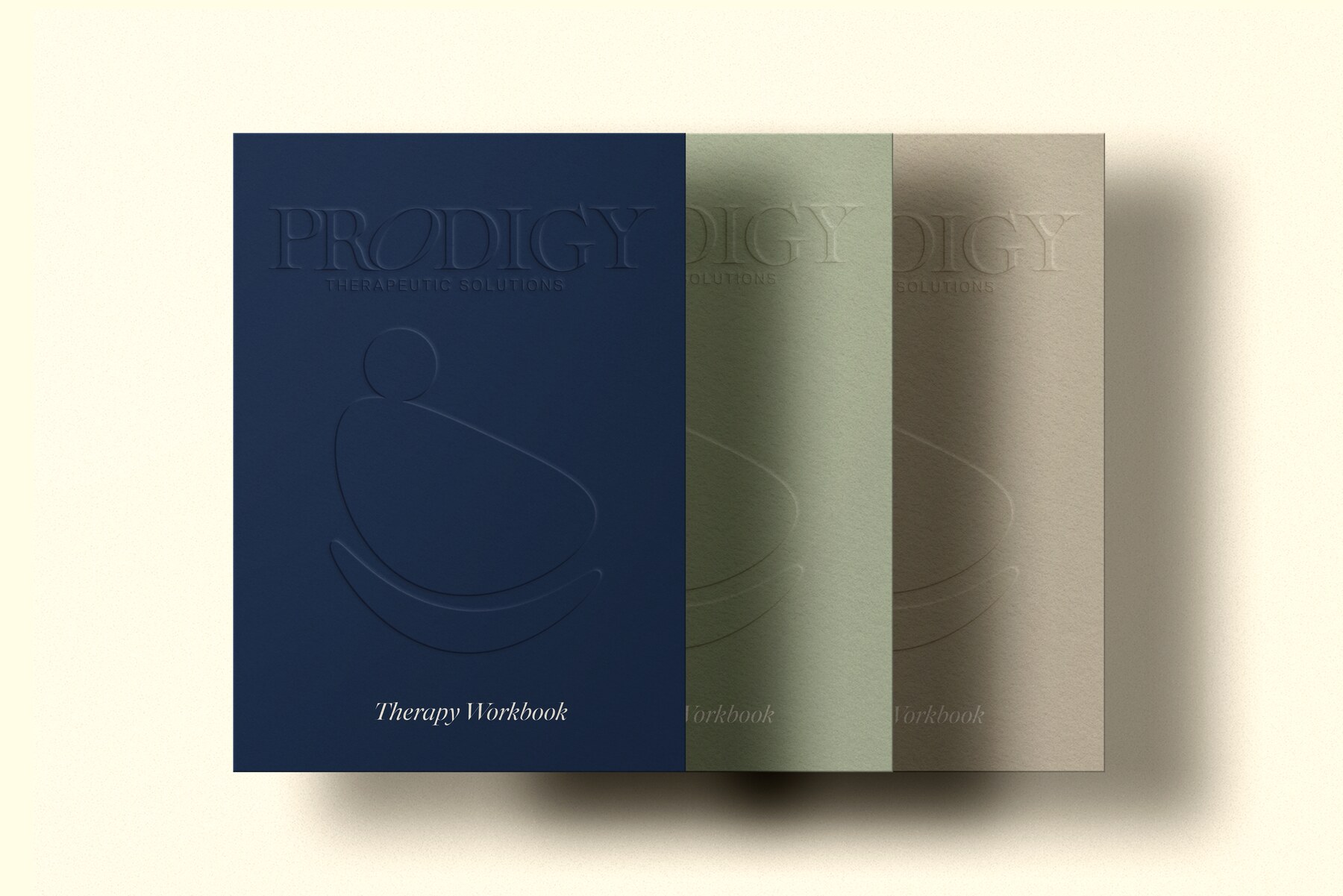 Prodigy therapy workbooks in navy, sage, and warm neutral